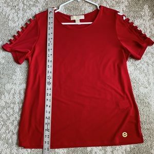 Michael Kors red blouse size large with detail on short sleeves